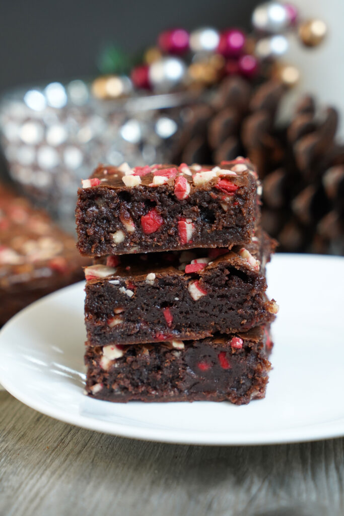 Three brownies stacked on top of one another.