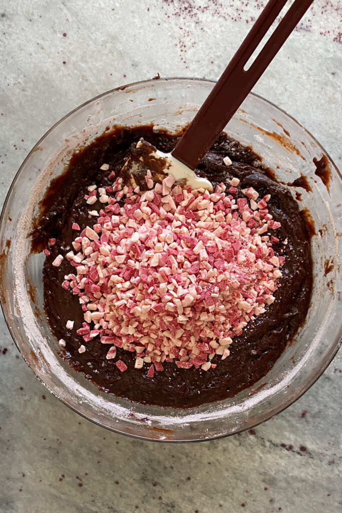 Andes Peppermint Baking Chips in a bowl with brownie batter.