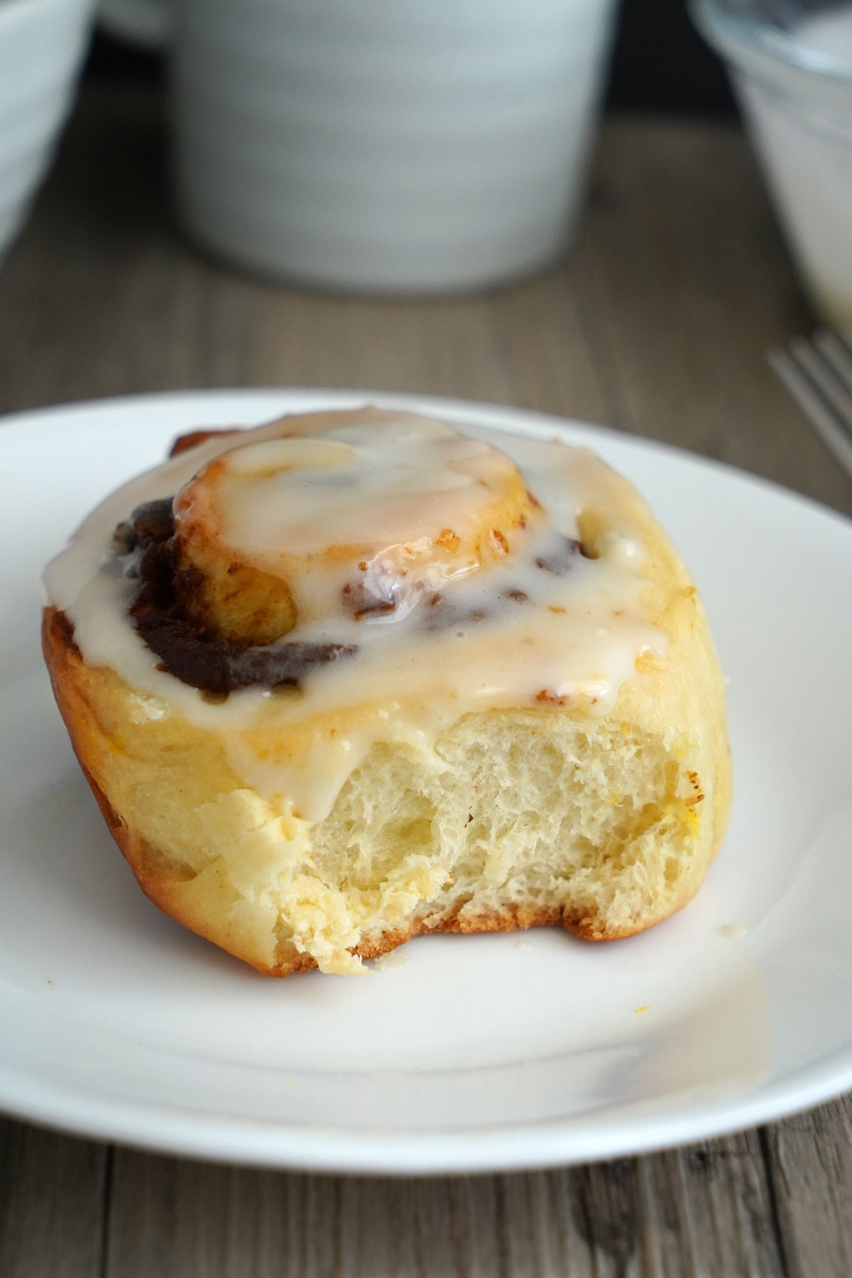 Pumpkin Spice Cinnamon Roll with cream cheese glaze on top.