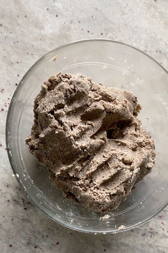 Cookies and Cream sugar cookie dough in a bowl.