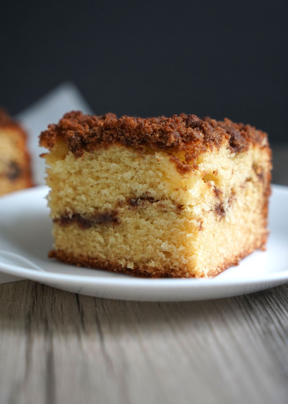 Slice of coffee cake on a white plate.