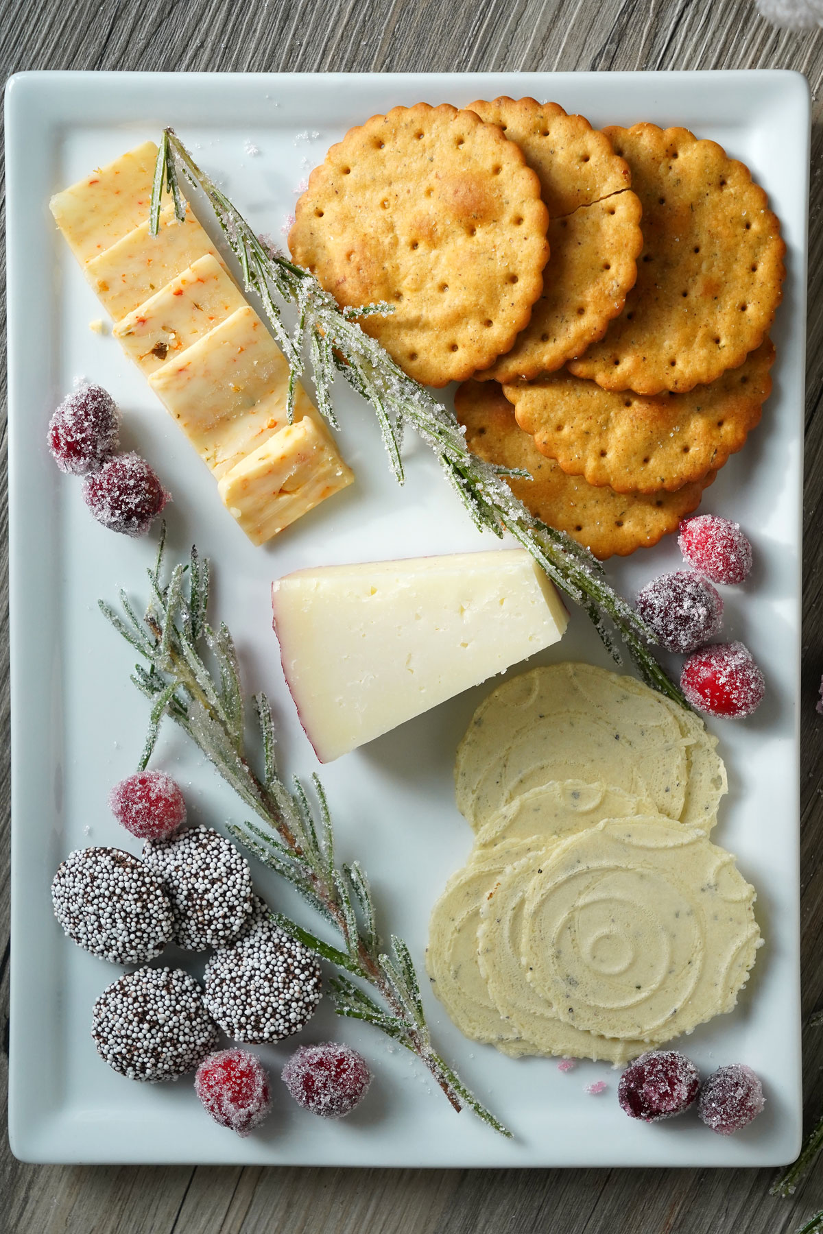 Sugared cranberries decorating a snack platter.