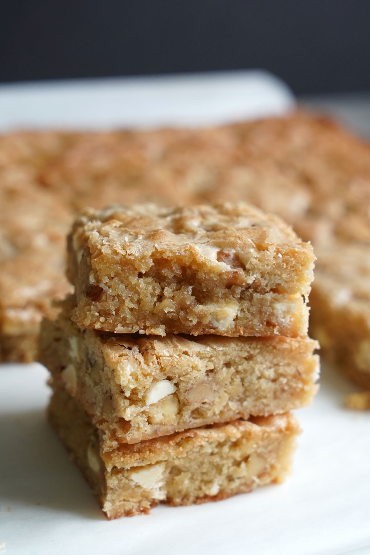 Stack of white chocolate blondies.