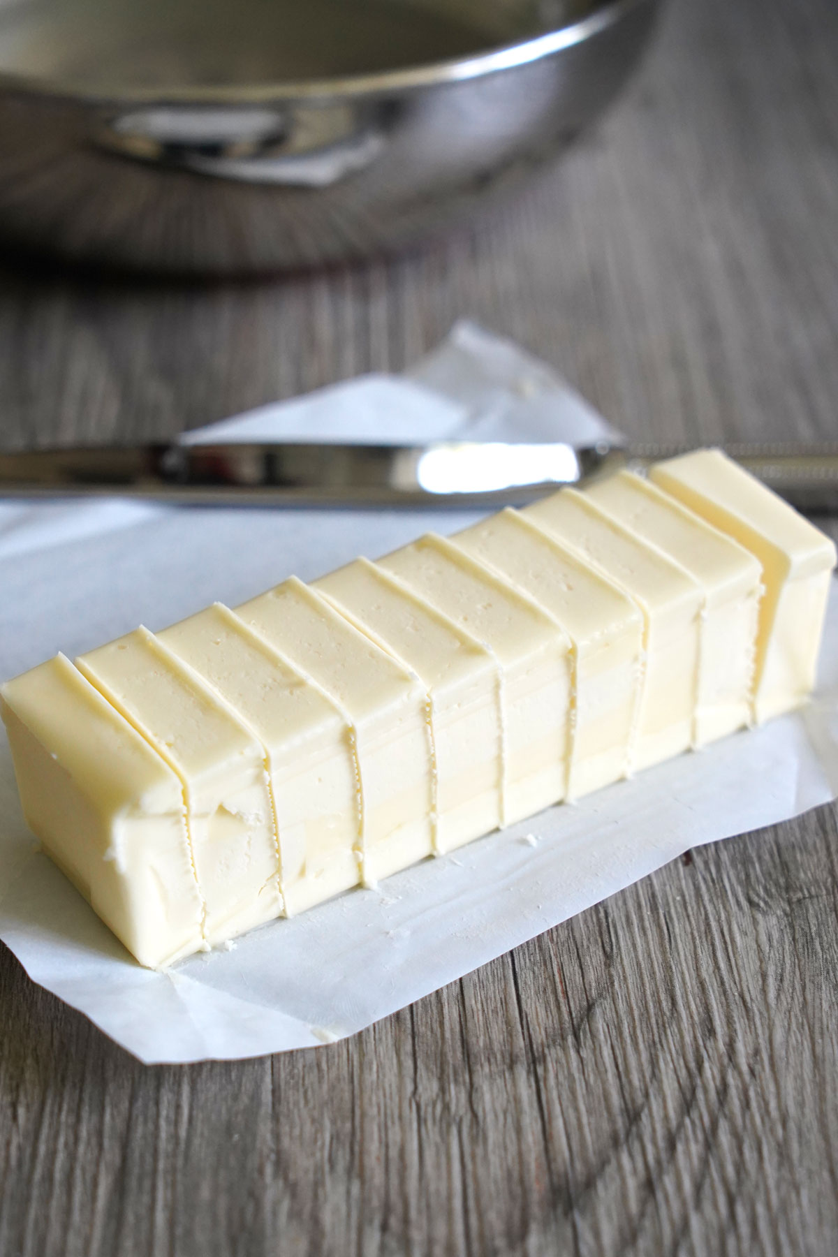 A stick of butter cut into small quarter inch slices.