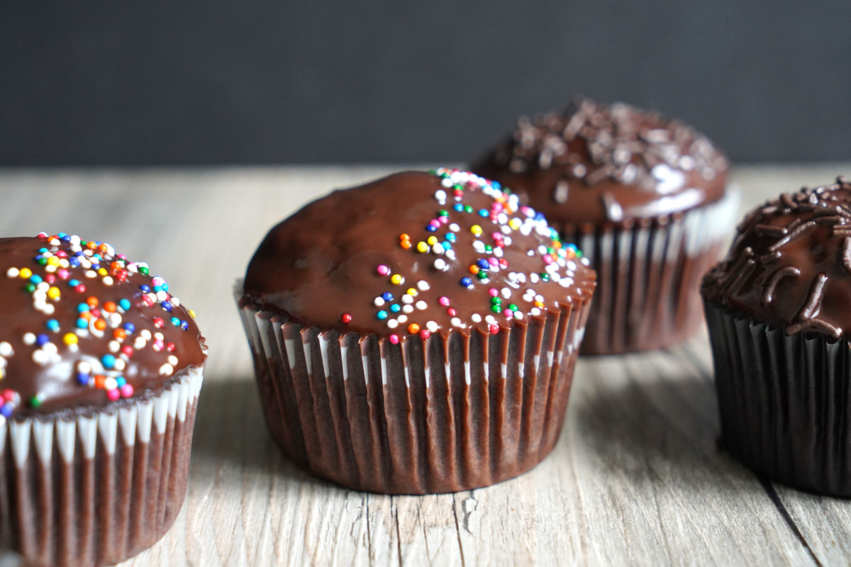 Horizontal photo of dark chocolate cupcakes.