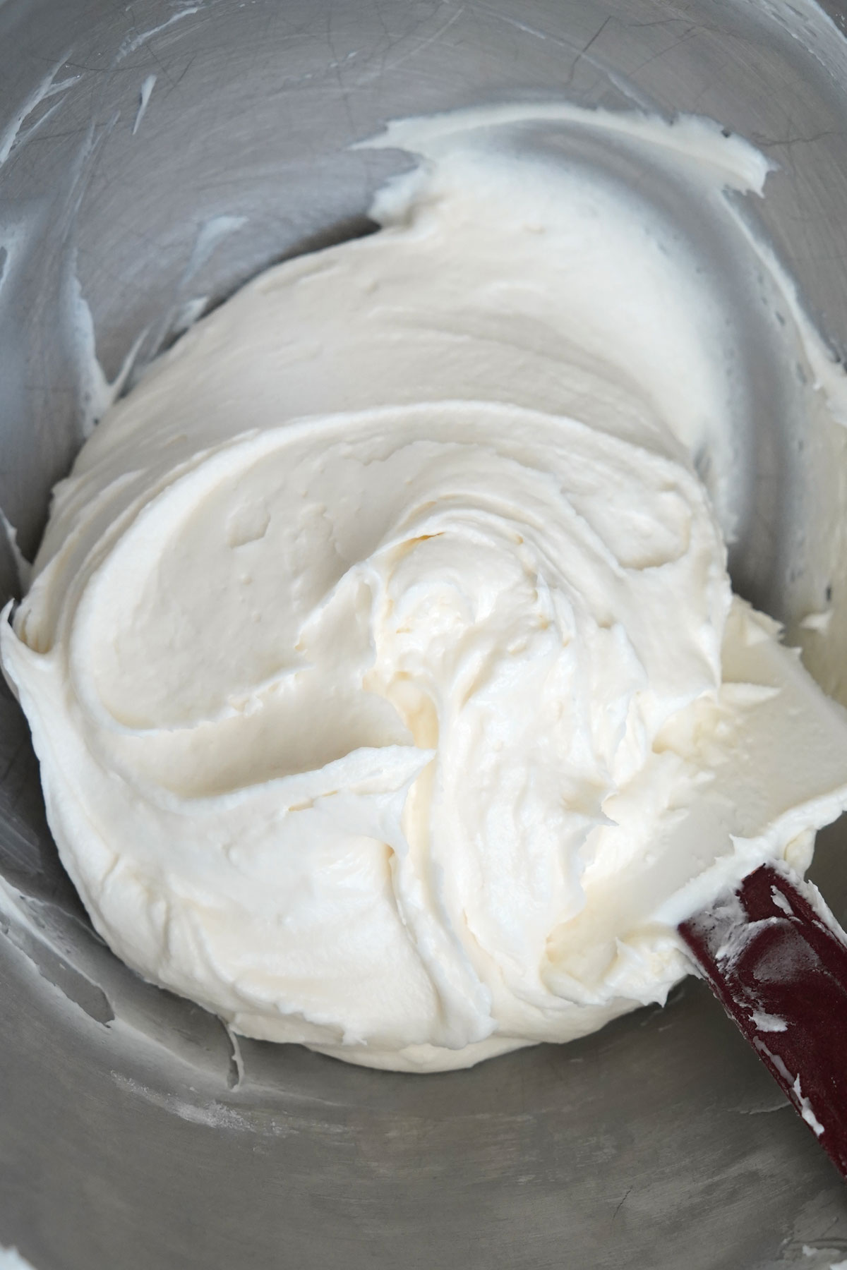 Frosting in mixing bowl with spat