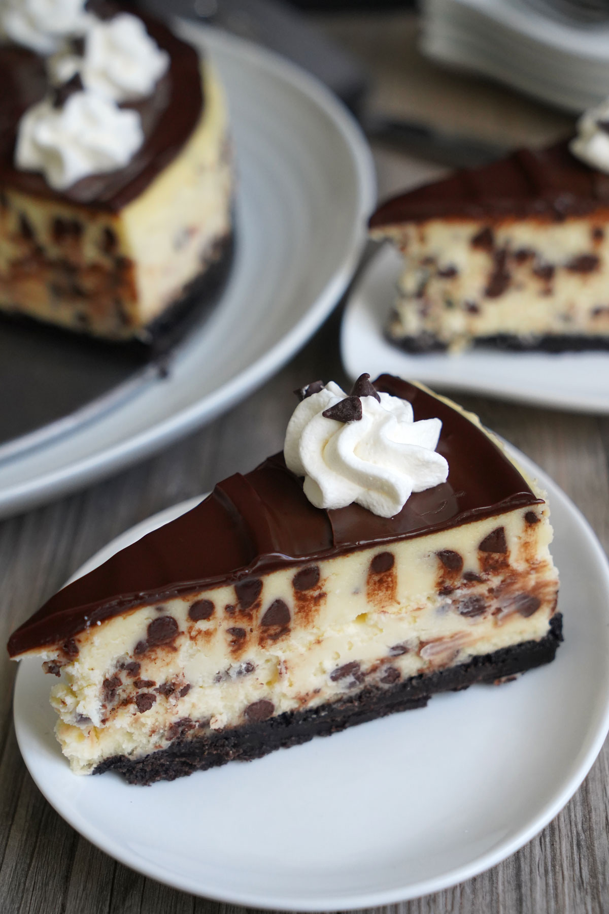 Slice of chocolate chip cheesecake on a white plate