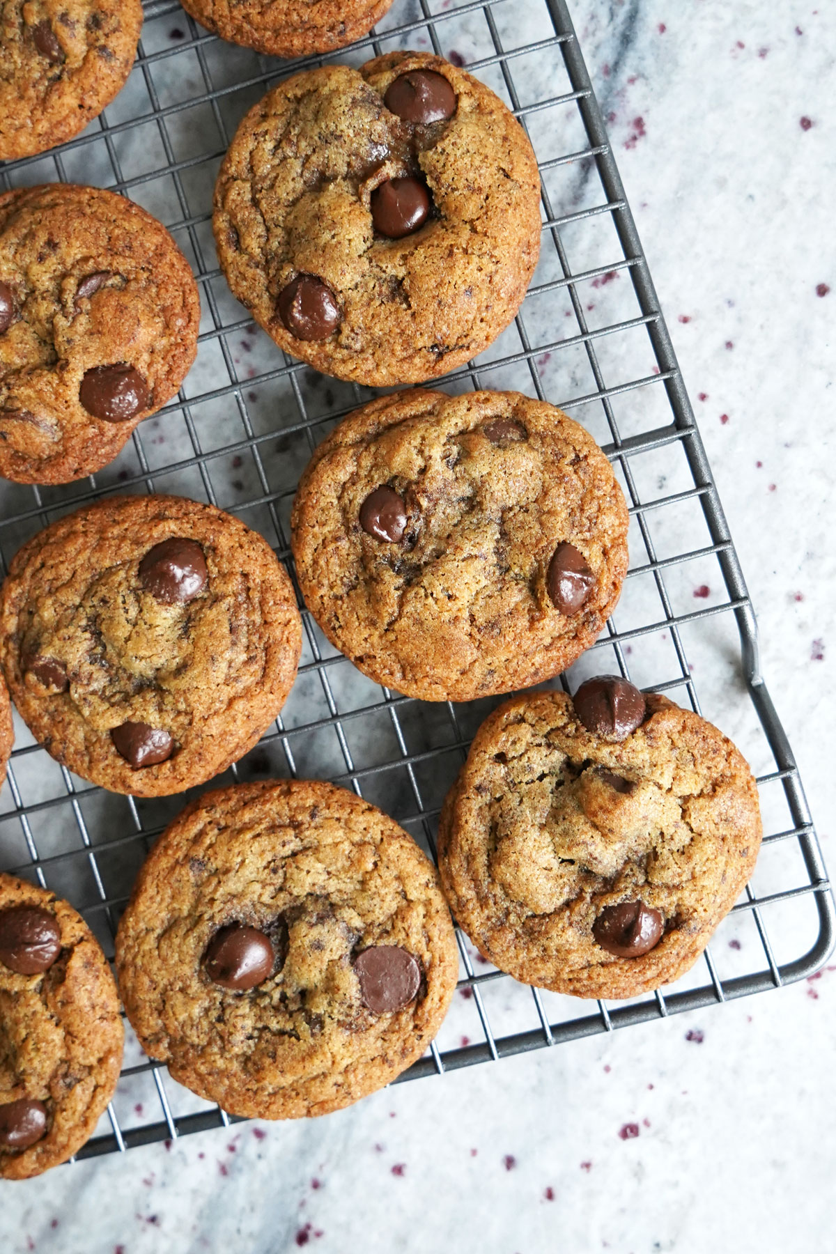 Espresso chocolate chip cookies cooling on wire rack.