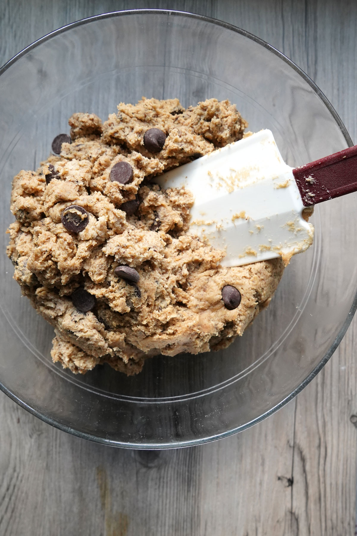 Espresso chocolate chip cookie dough in a glass bowl.