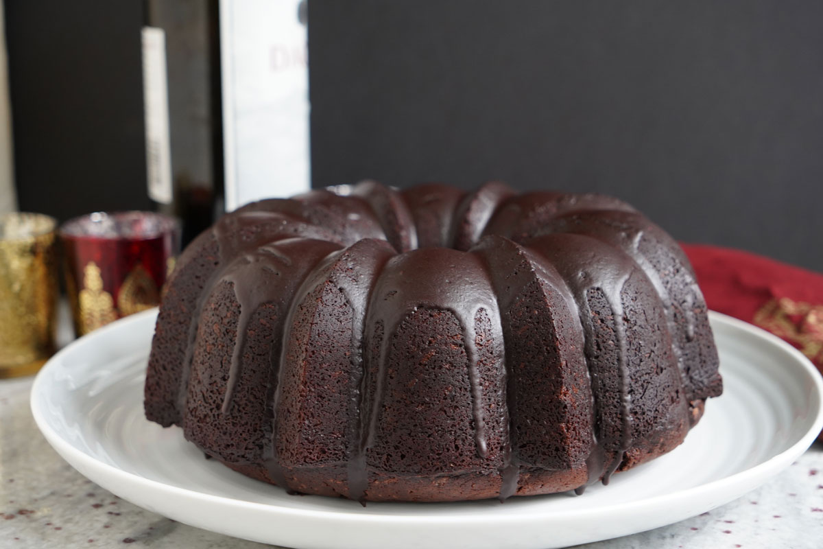 Finished bundt cake on white platter.