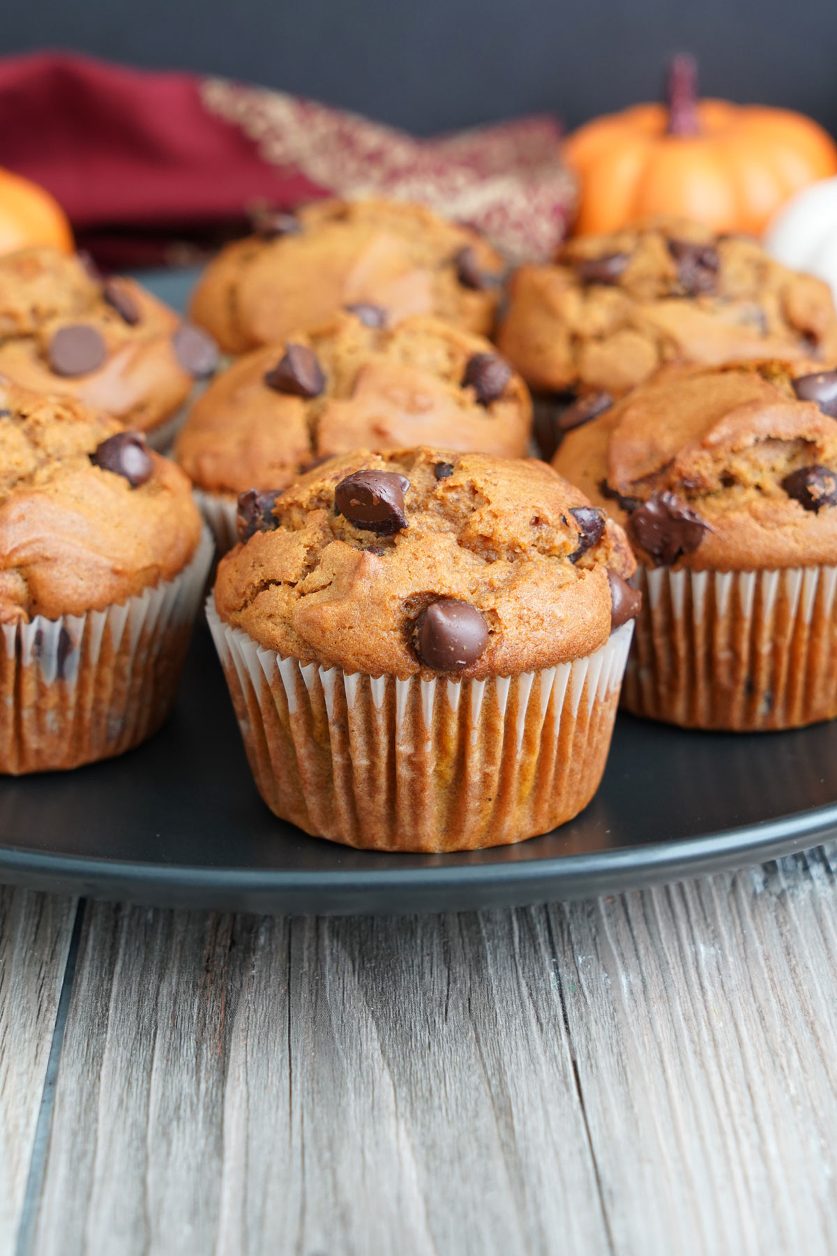 Pumpkin muffins on a black plattter.