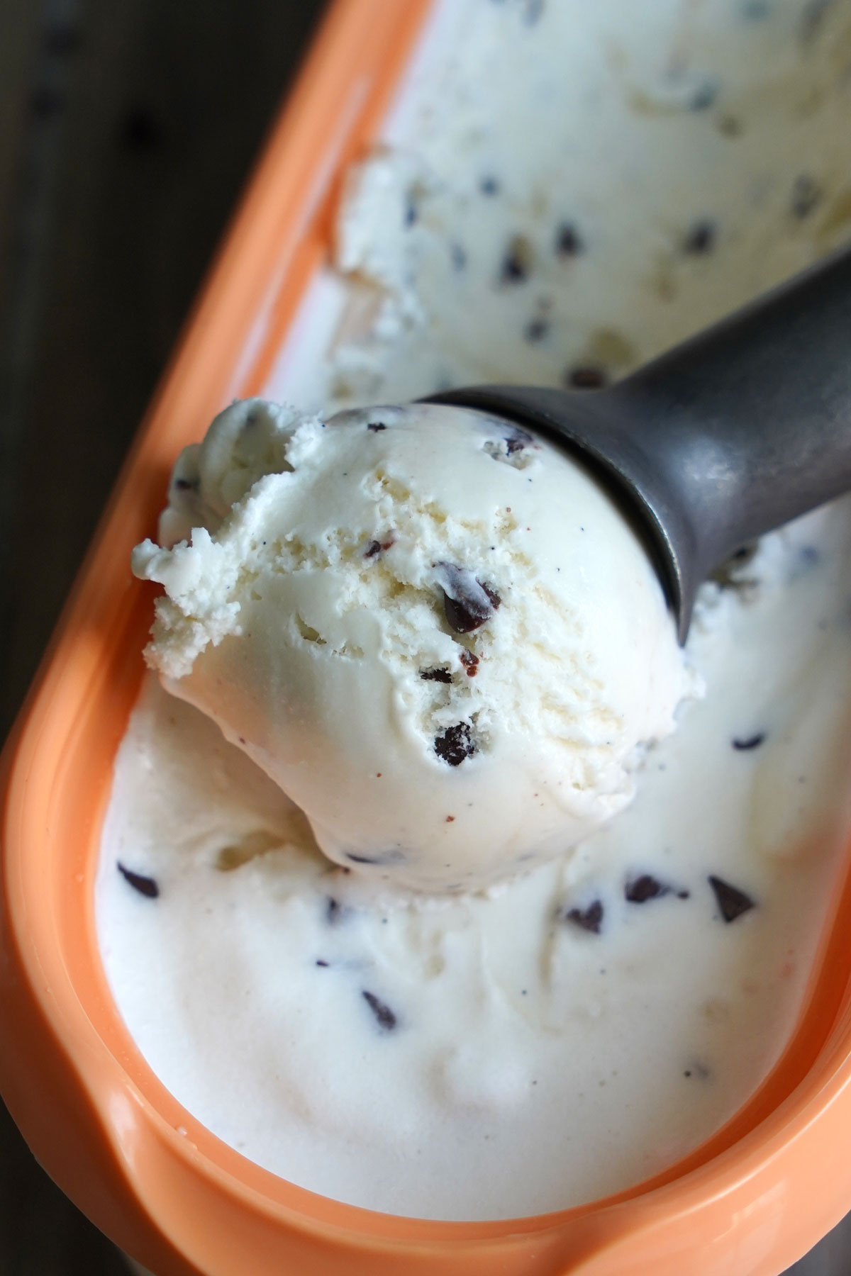 Close up of scooped ice cream from container.