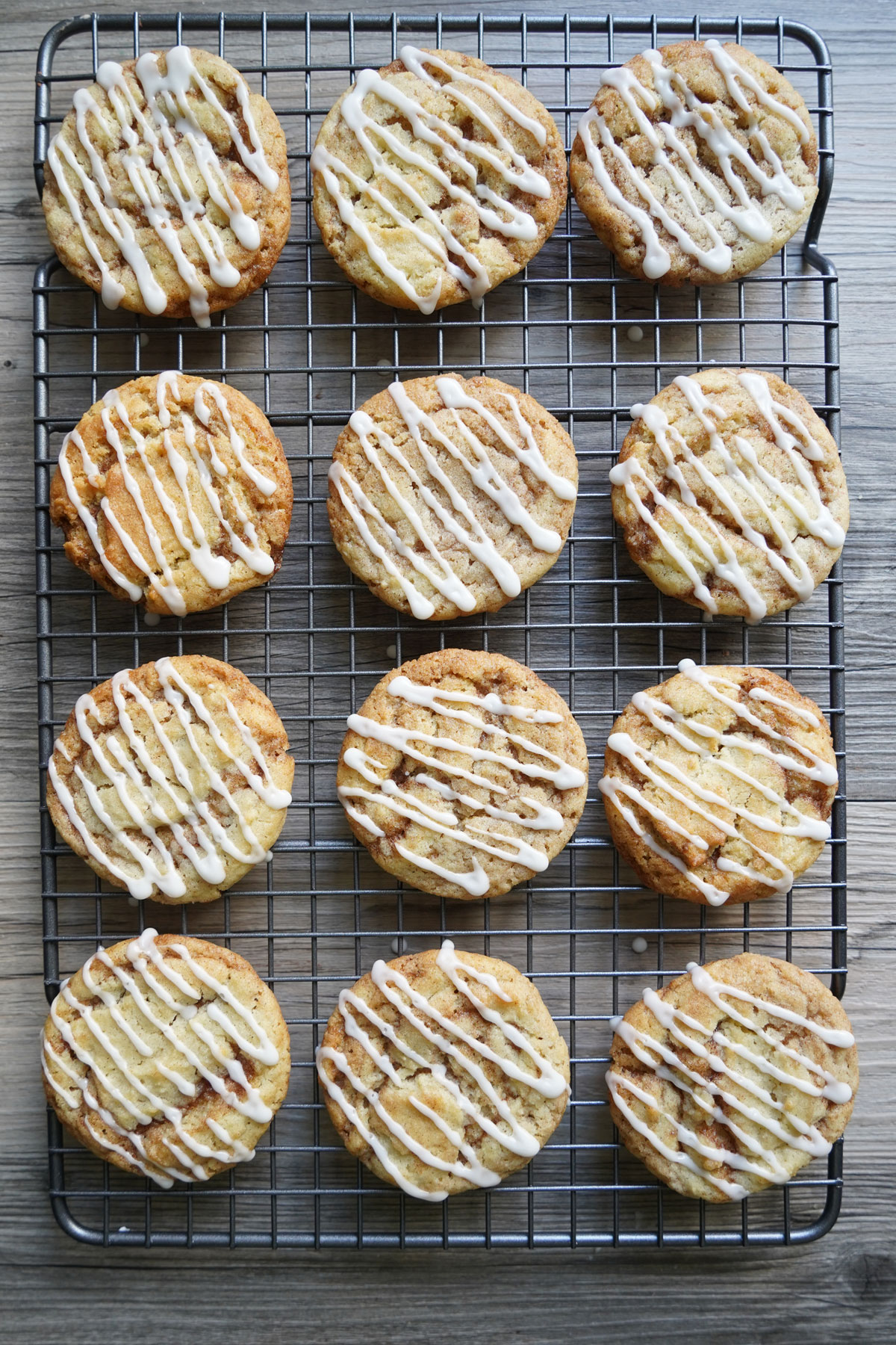 Iced cookies on cooling rack.