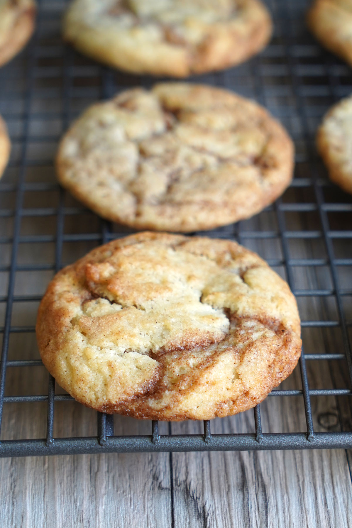 Closeup photo of cinnamon roll cookie showing swirls of filling.