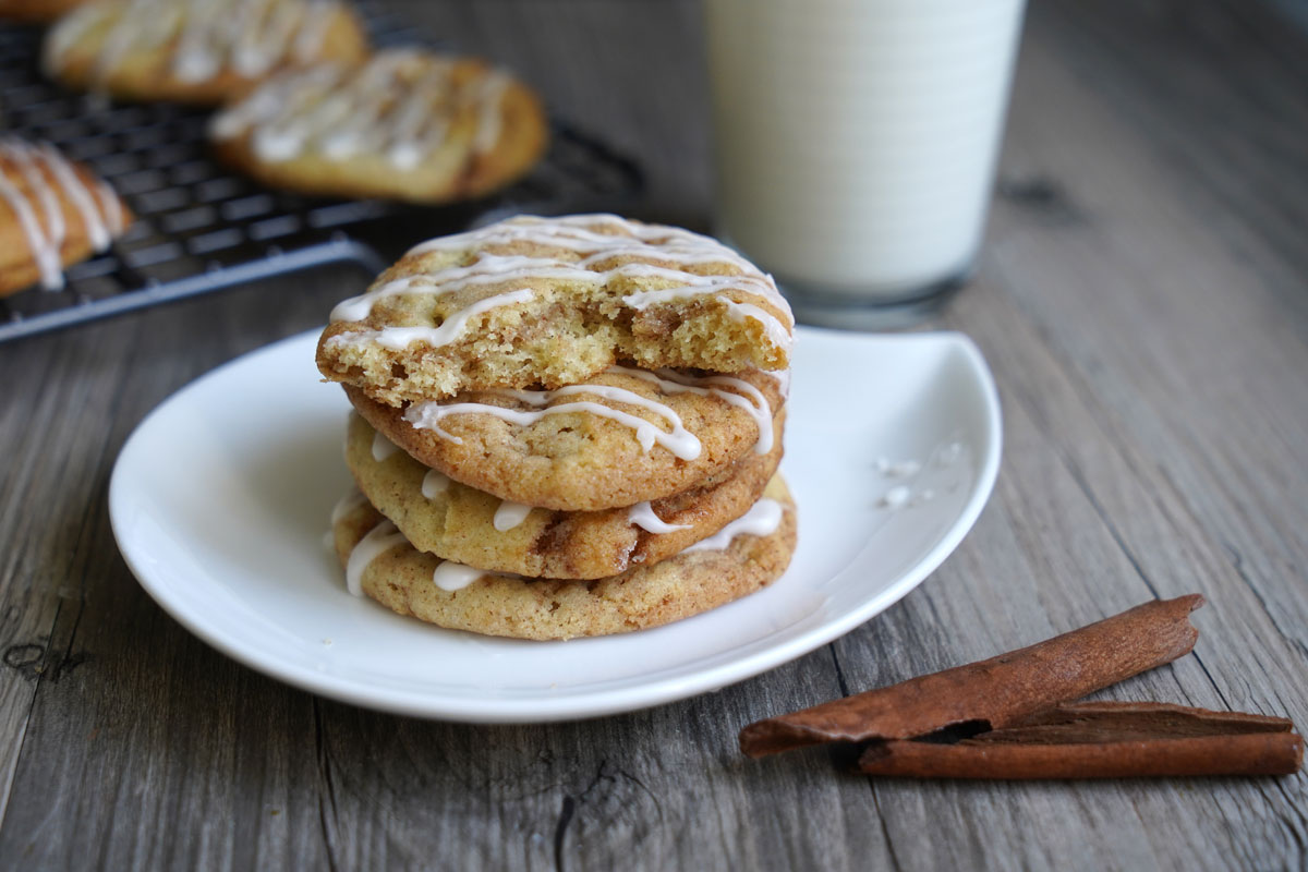 Cookies stacked on plate with half cookie on top showing inside texture.