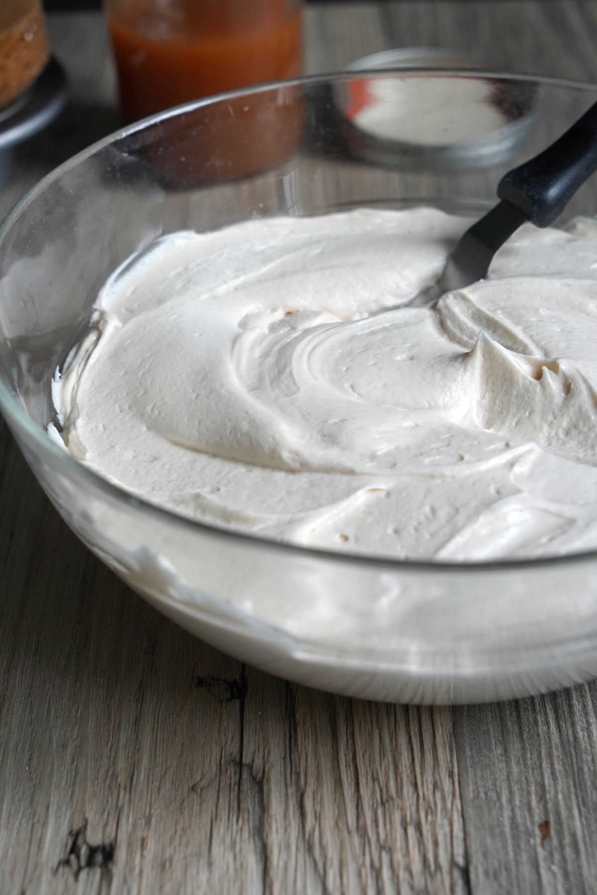 Close up view of bowl full of salted caramel frosting.