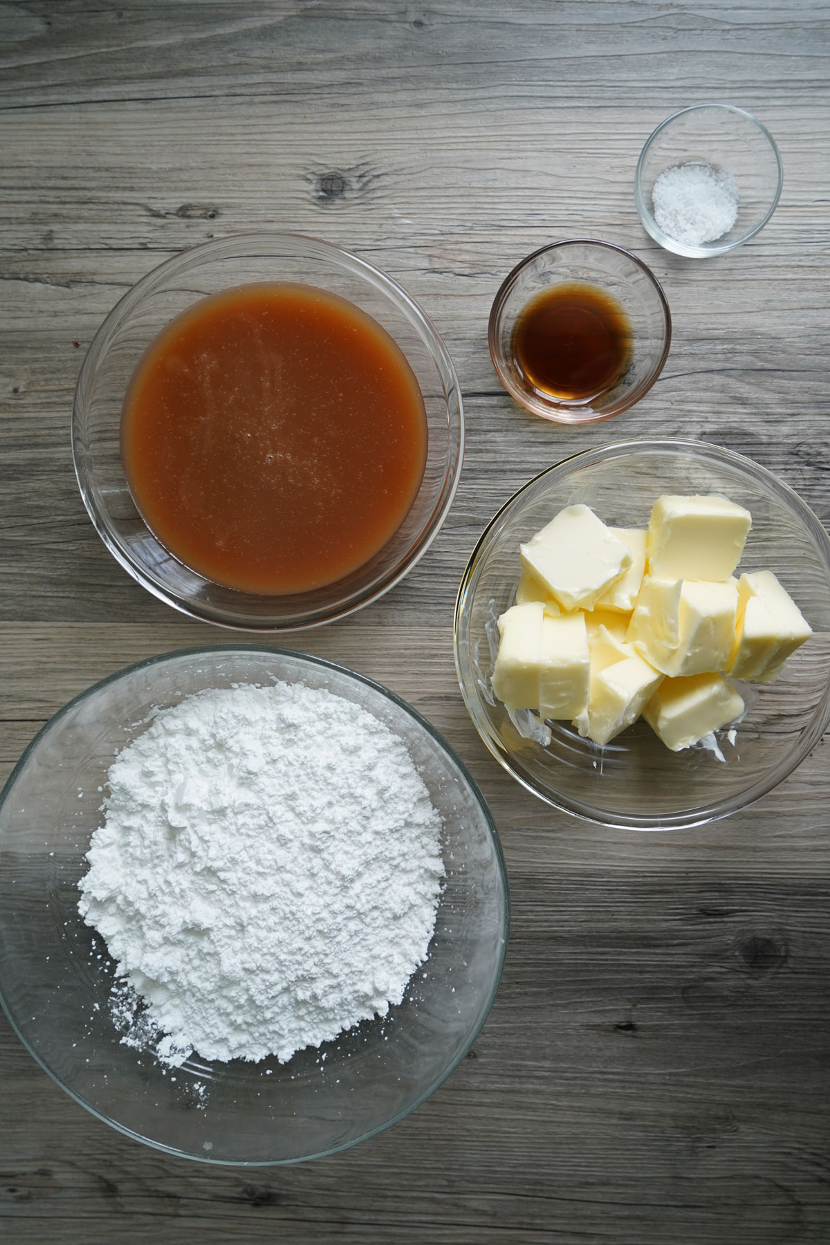 Ingredients of salted caramel frosting: salted caramel sauce, salt, butter, confectioner's sugar.