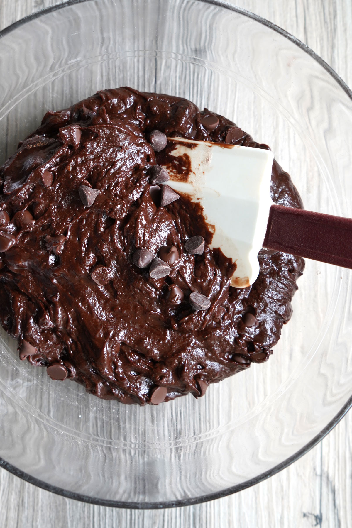 Double Chocolate cookie batter in a glass bowl. 