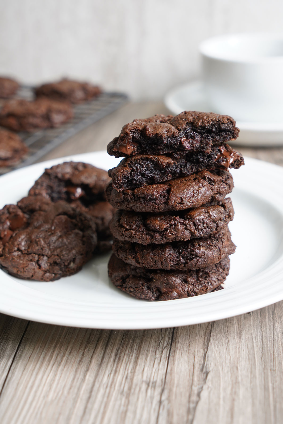 Stack of double chocolate vegan cookies on white plate. 