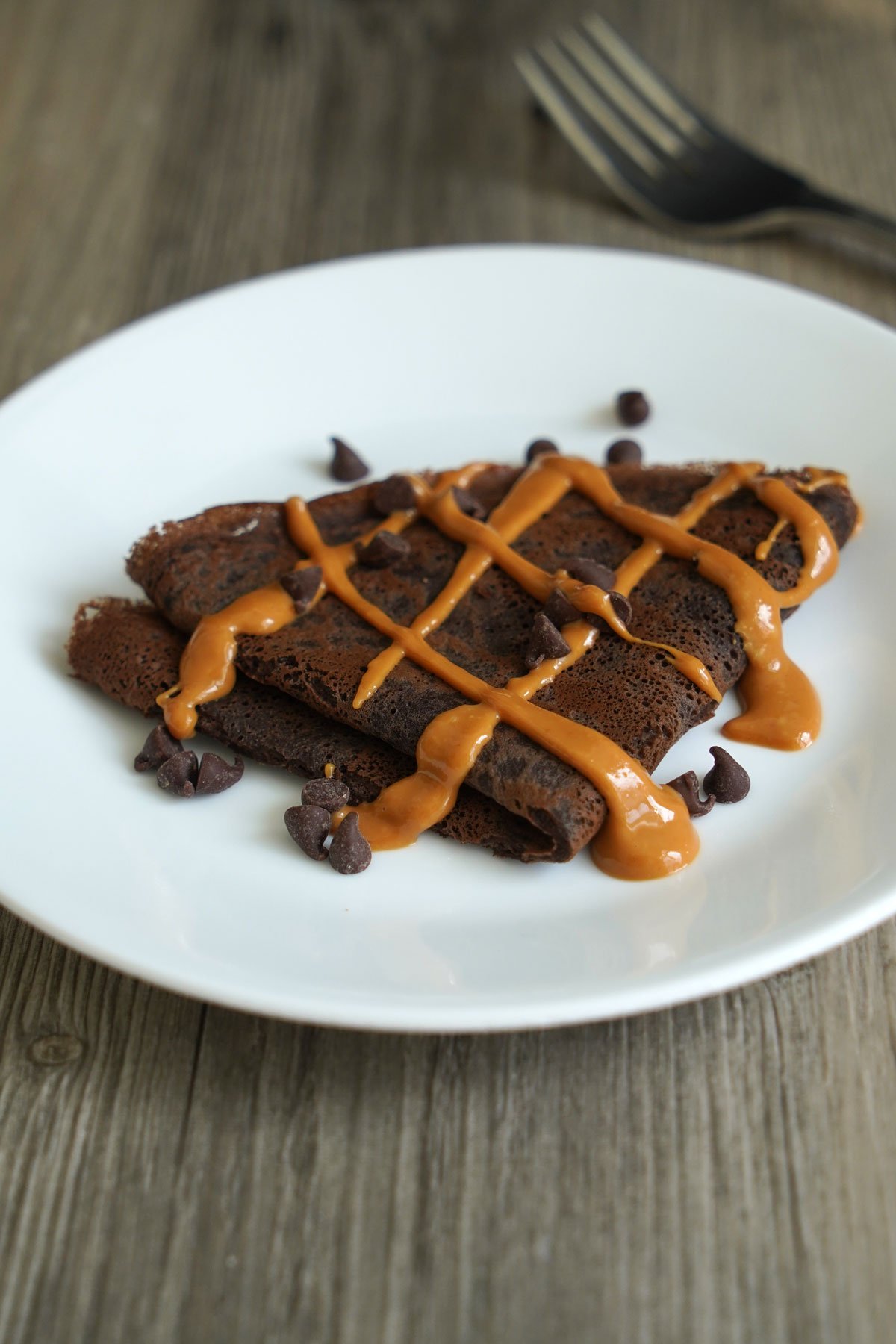 Chocolate crepe drizzled with peanut butter.