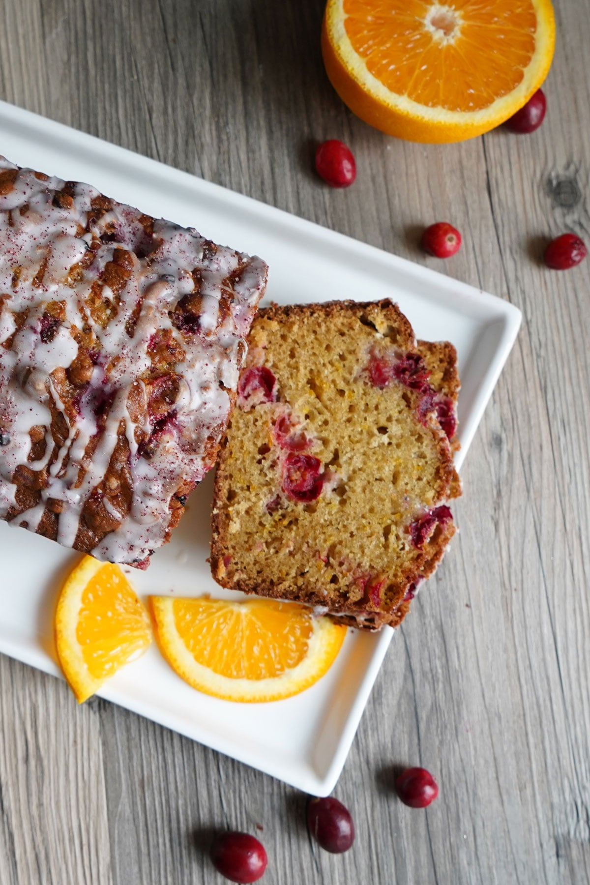 Top view of sliced orange cranberry bread to show off the tender crumb texture