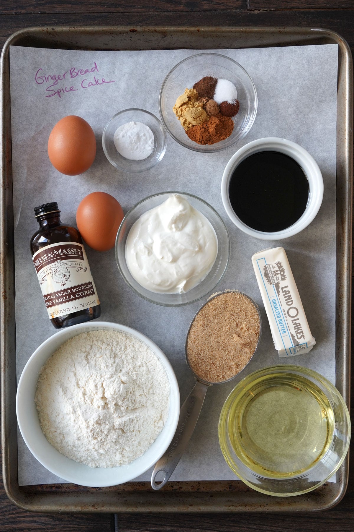 Gingerbread spice cake ingredients gathered in a tray.