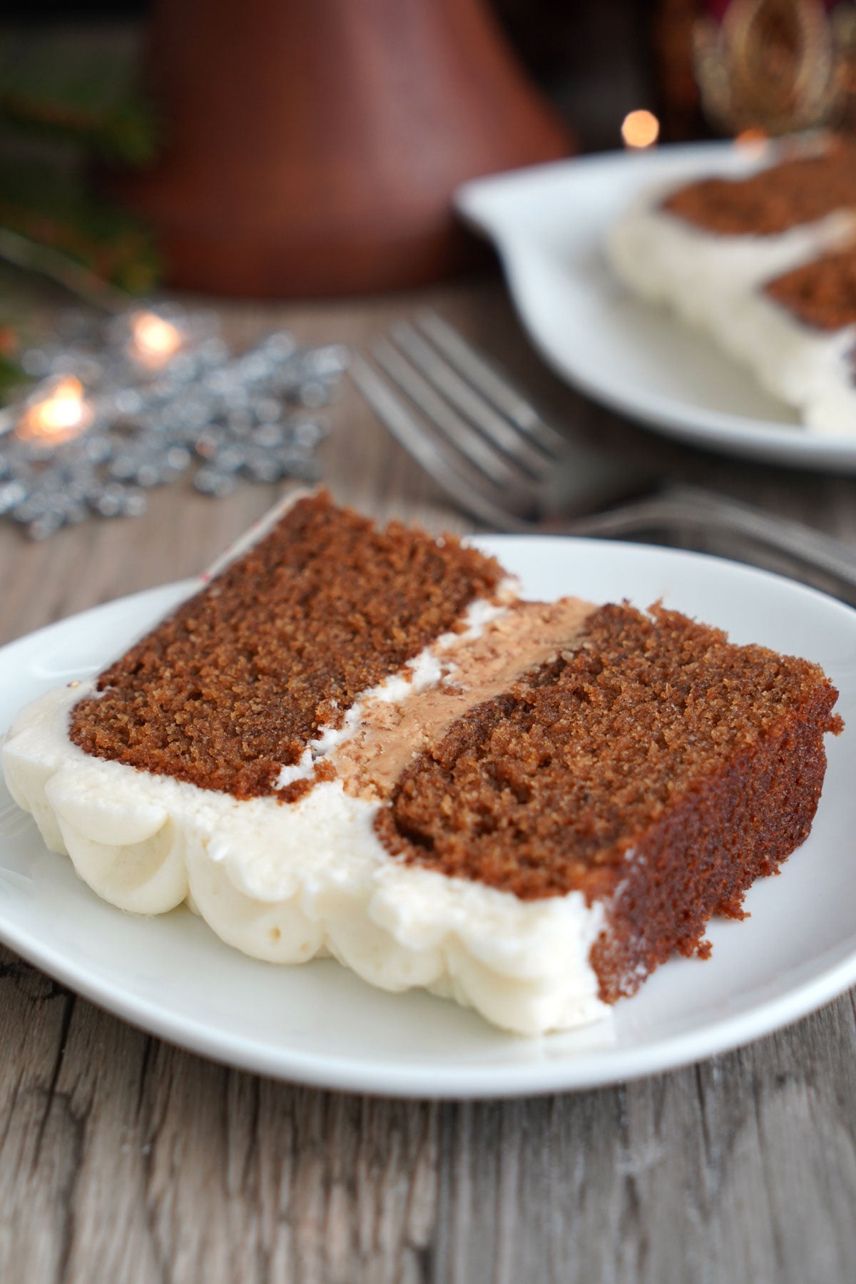 Slice of gingerbread spice cake on a plate.