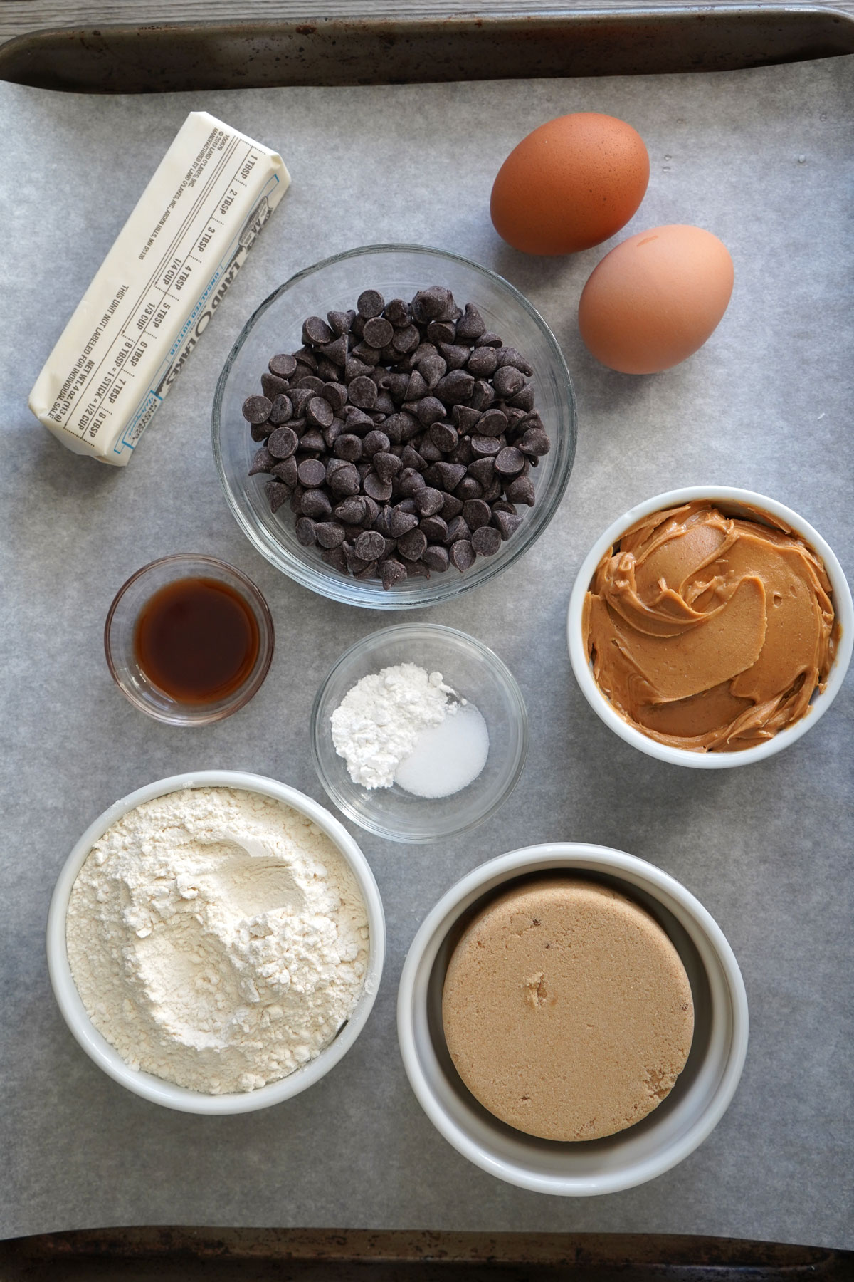 Ingredients for making peanut butter chocolate chip cookie bars.