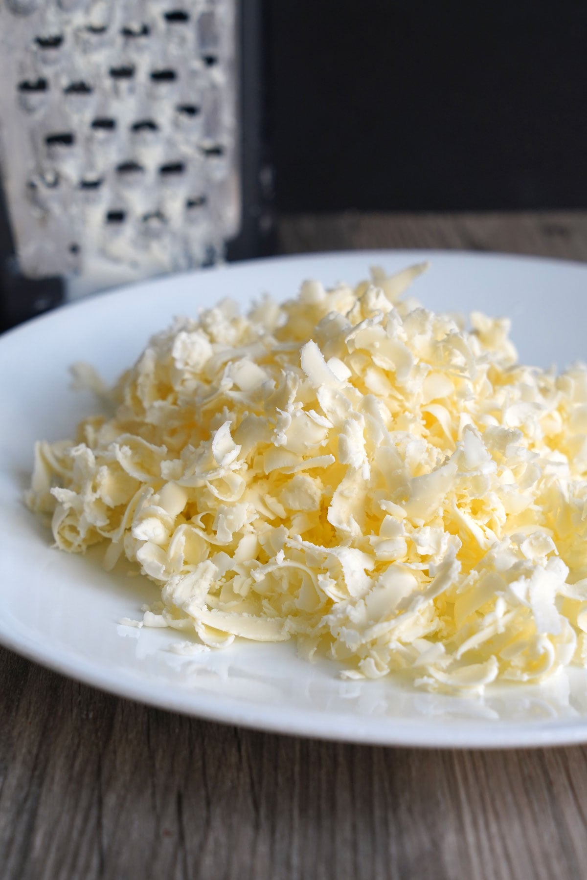 Grated frozen butter in a plate. 