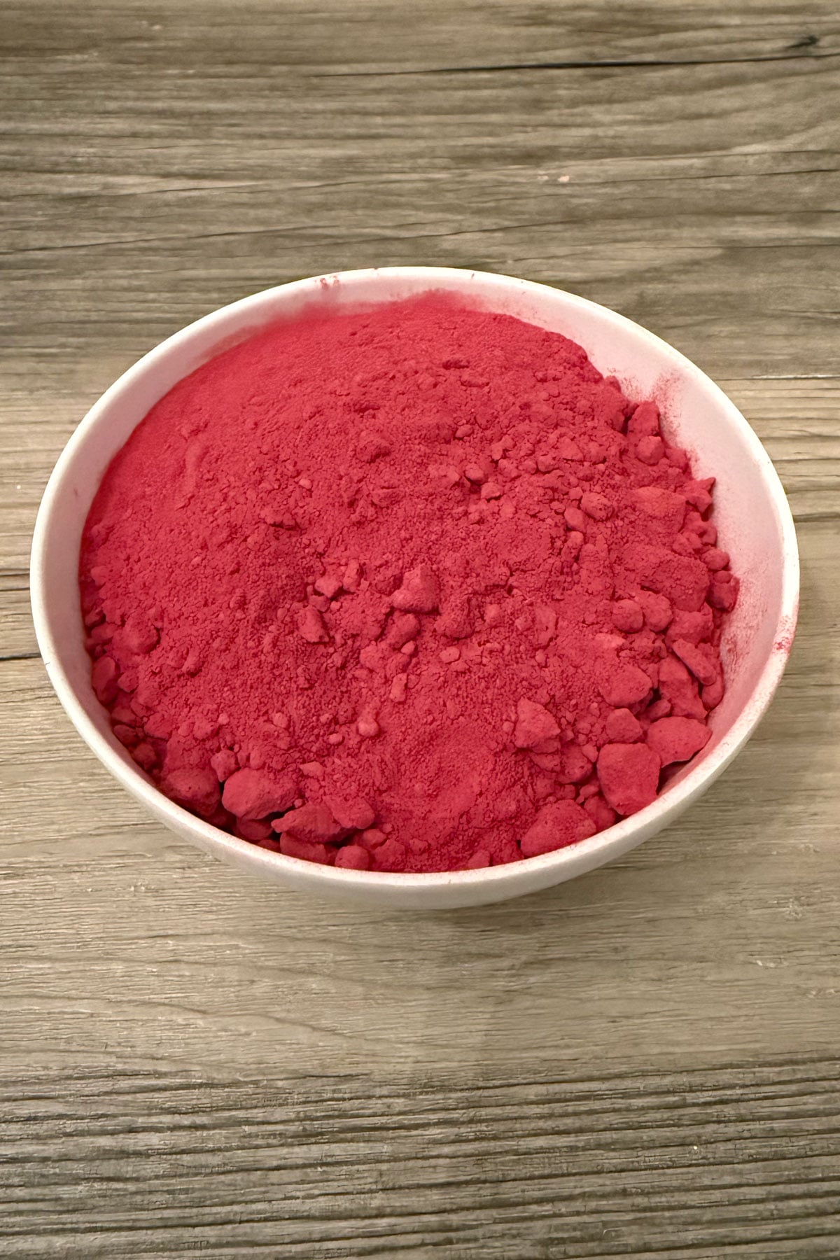 Beetroot powder in white bowl.