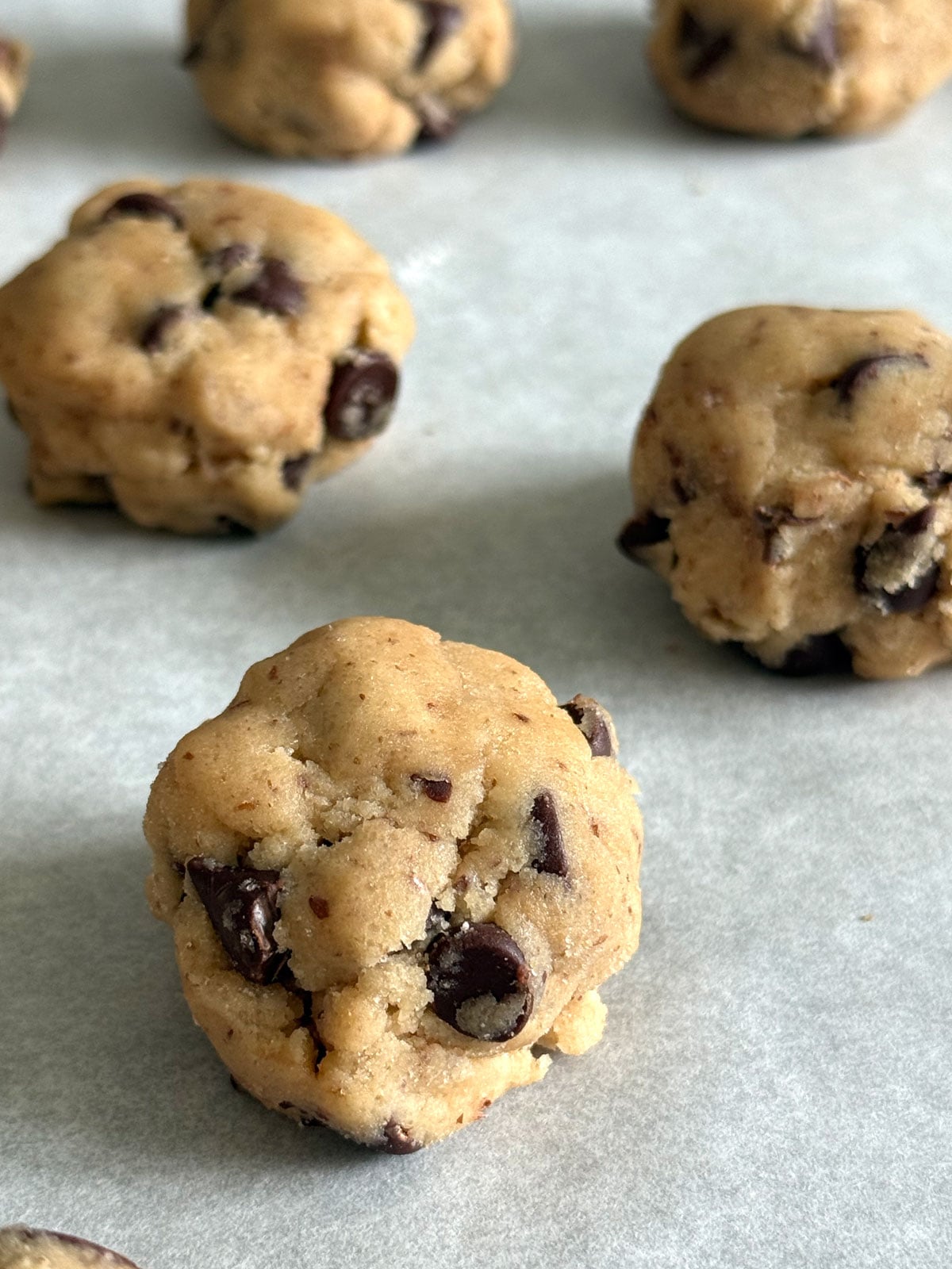Cookie dough portioned out into balls. 