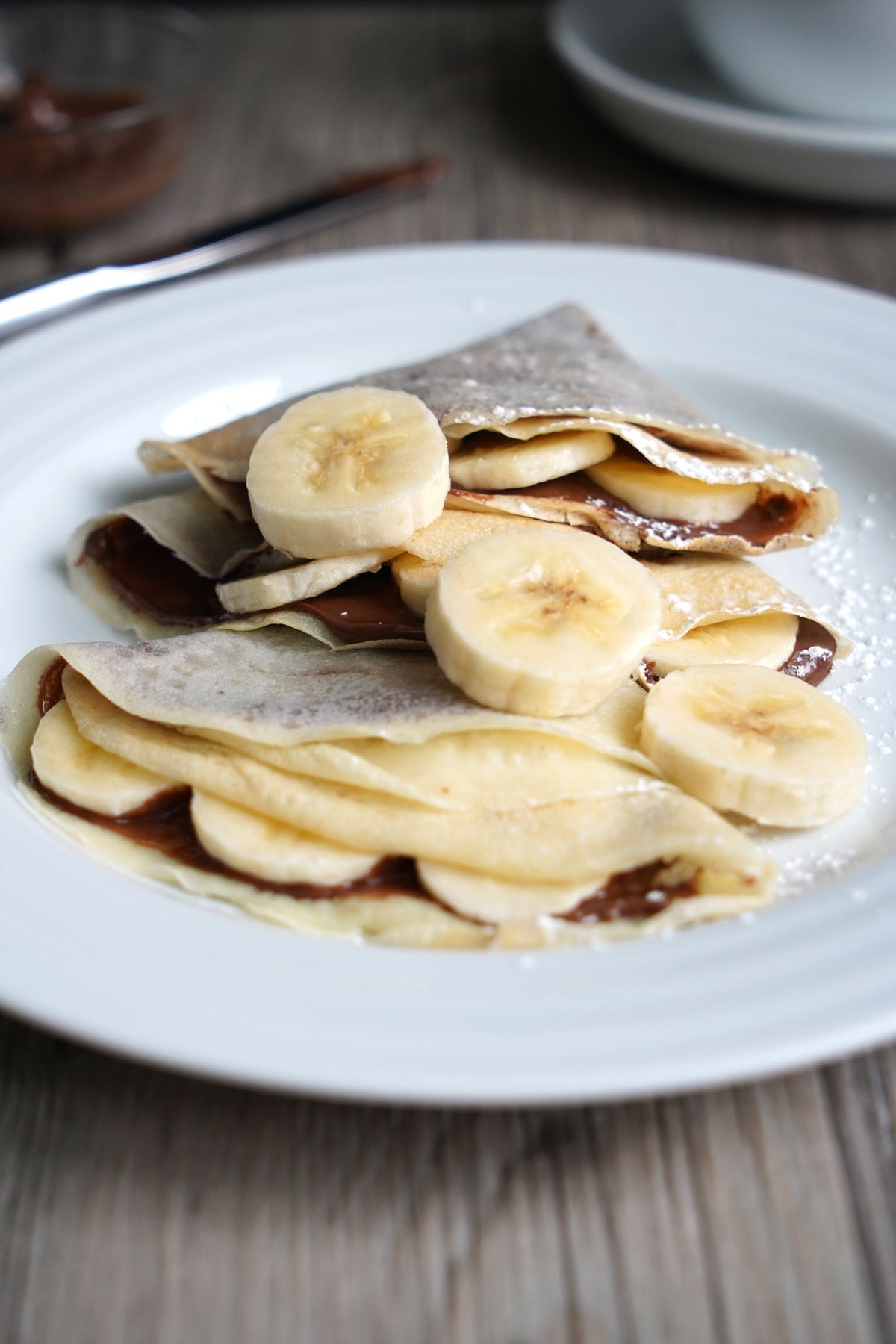 Crepes made with pancake mix filled with Nutella and sliced bananas.