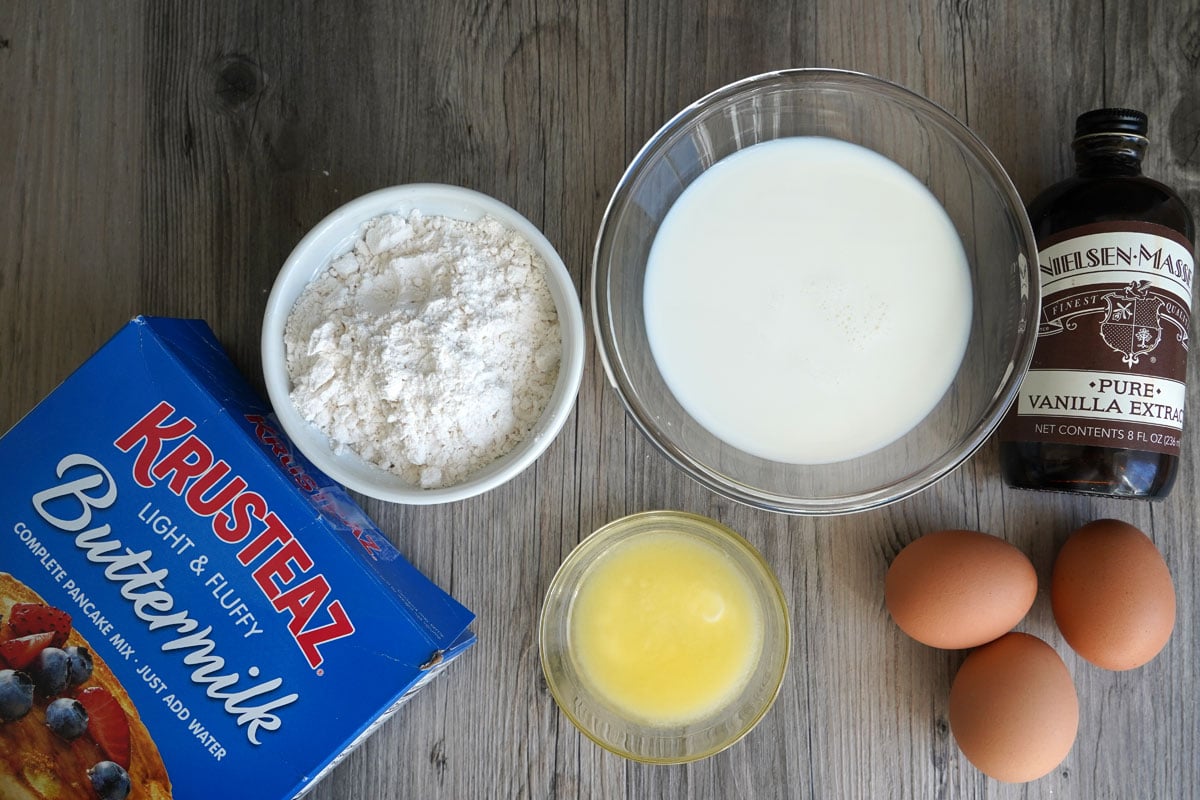 Ingredients for making pancake mix crepes: pancake mix, melted butter, milk, eggs, vanilla extract. 