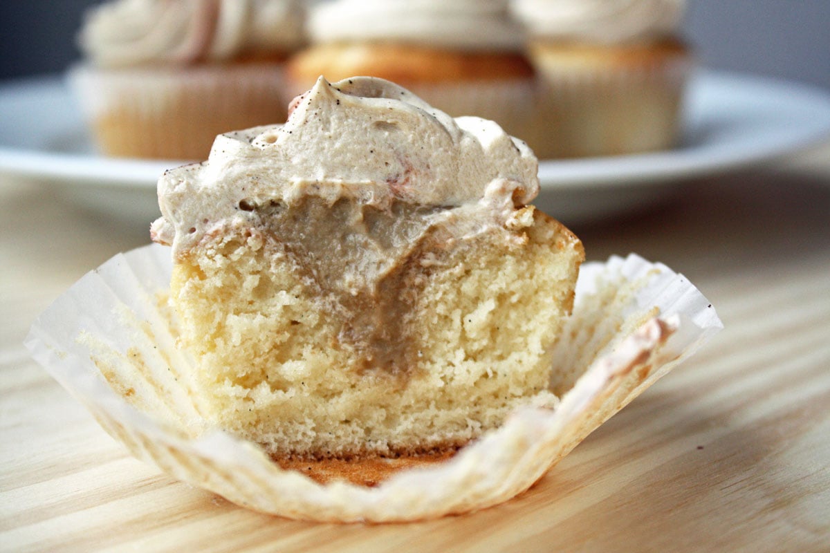 Vanilla Latte cupcake cut open to show  espresso filling inside. 