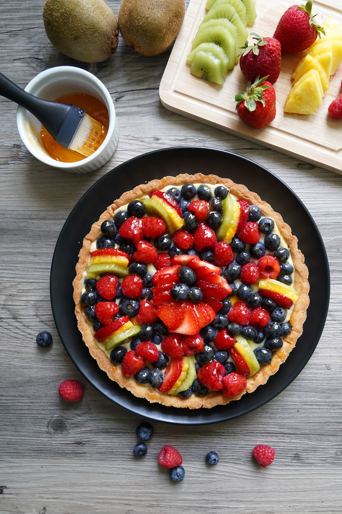 A finished fruit tart after applying glaze.