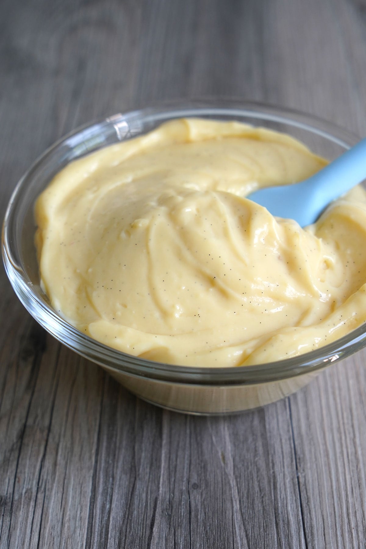 Smooth silky vanilla bean pastry cream in a bowl.