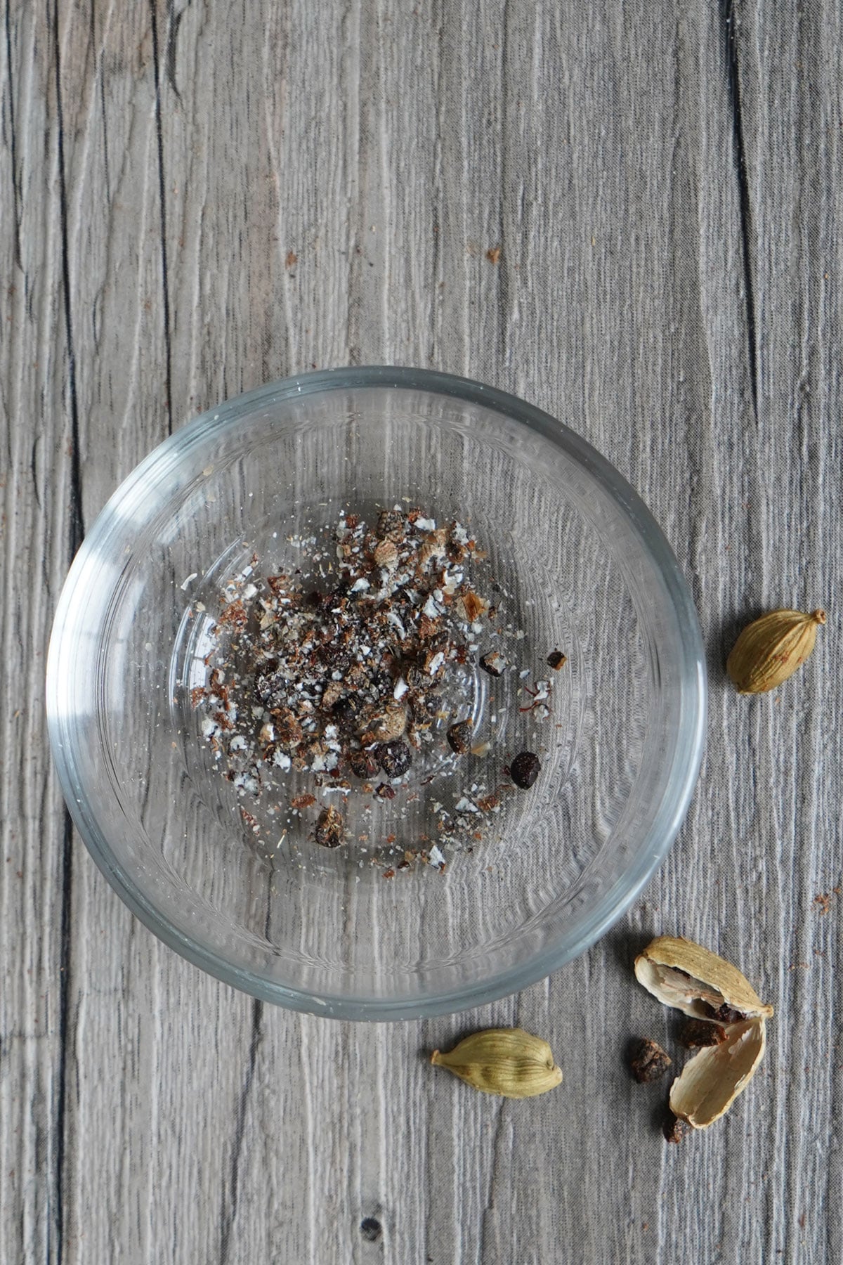 Crushed cardamom pods in a bowl.
