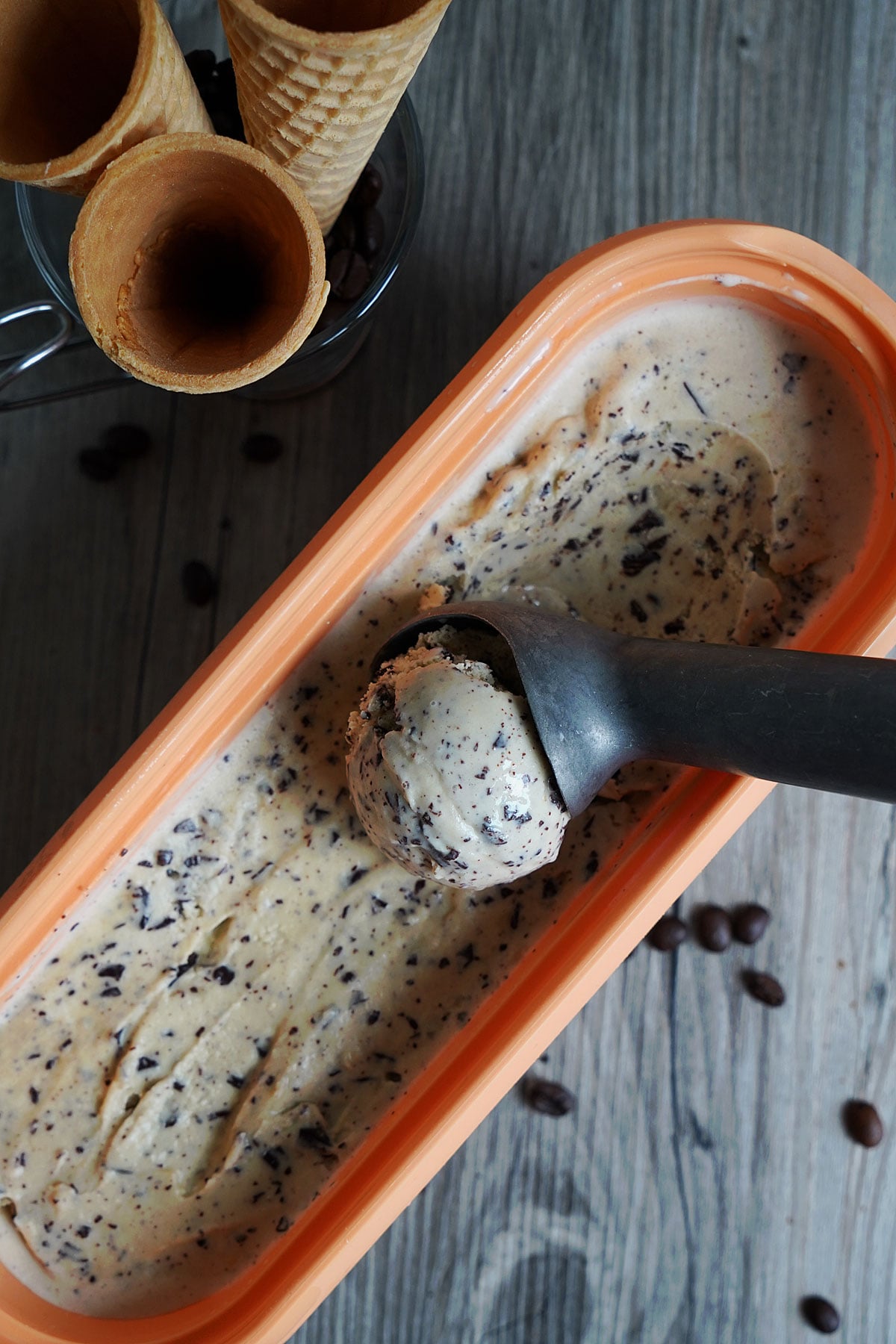 ICe cream being scooped from container.