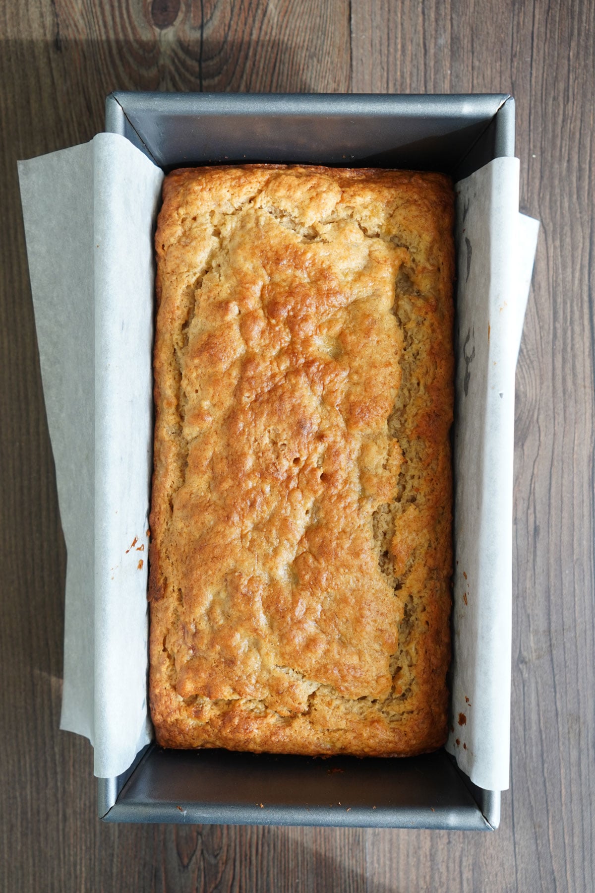 Finished loaf of pancake mix banana bread cooling in the pan.